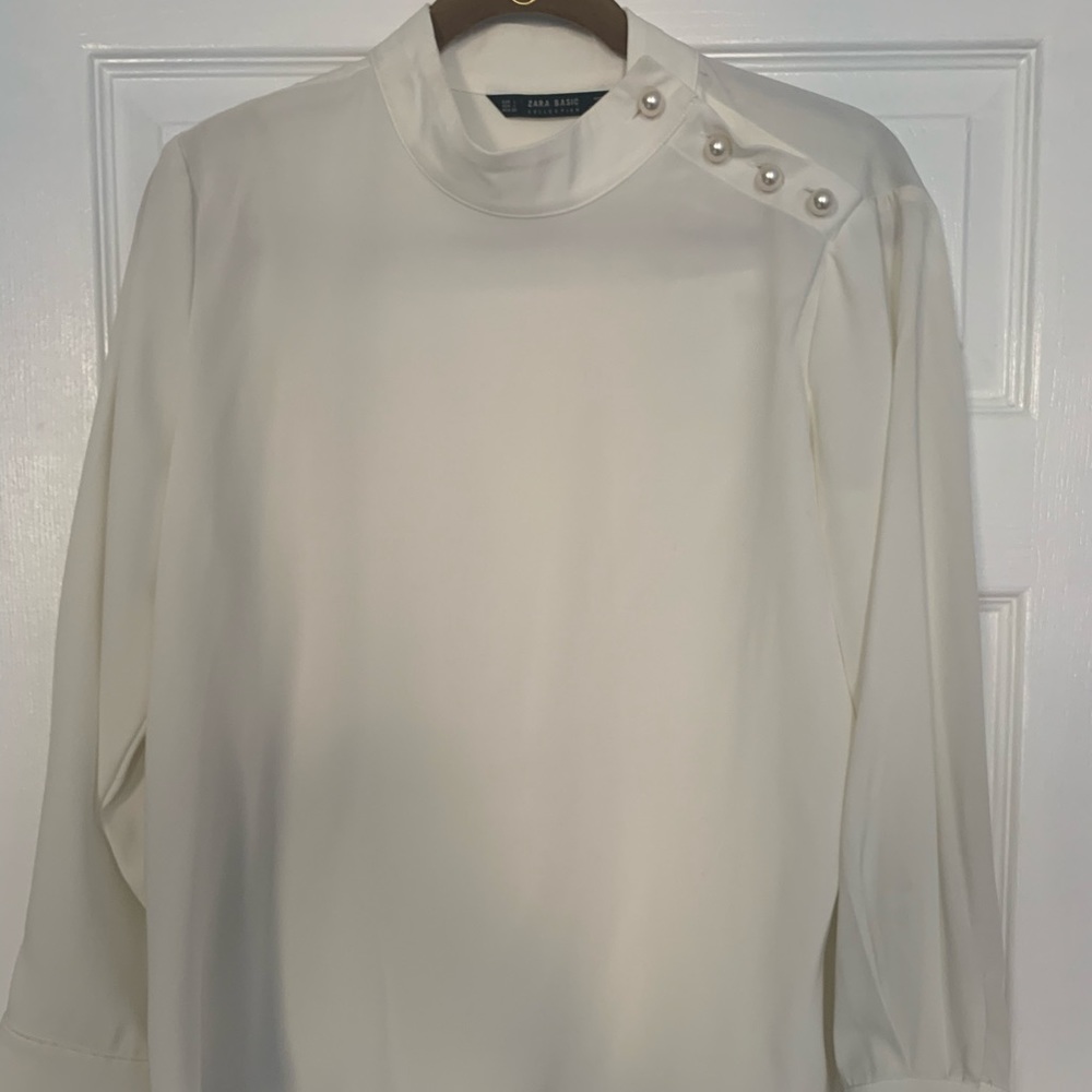 White with faux pearls blouse